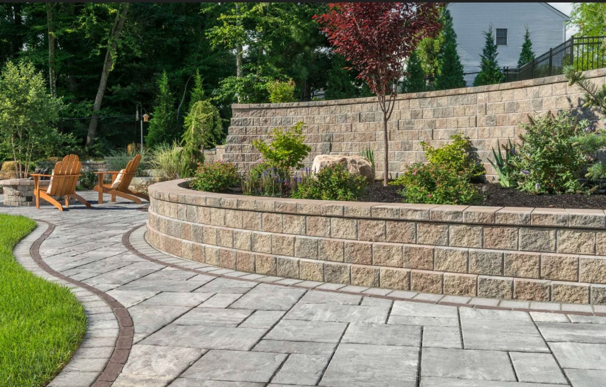 Terraced retaining wall installation transforming a sloped yard in Greater Binghamton NY
