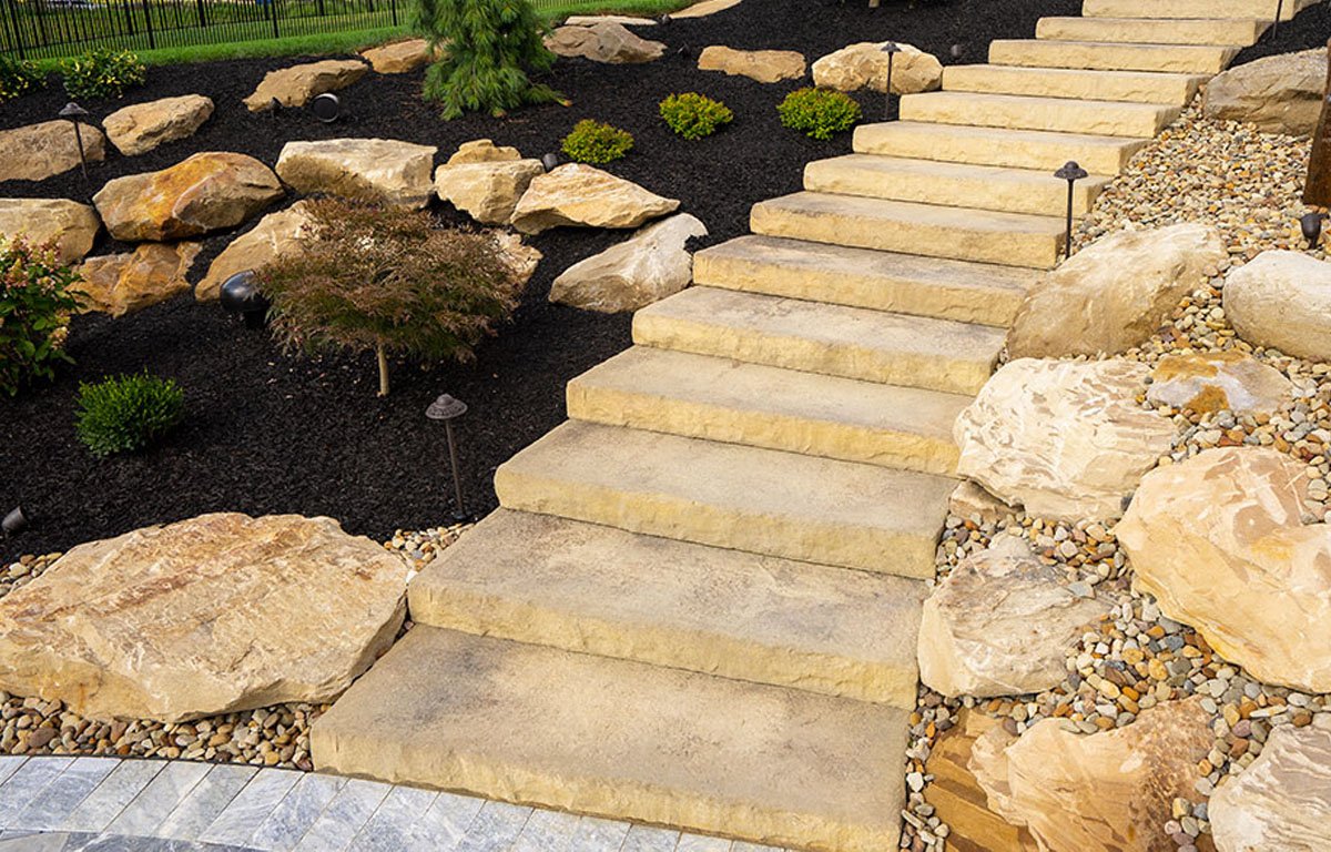 Custom paver patio with outdoor seating area in a Greater Binghamton NY backyard