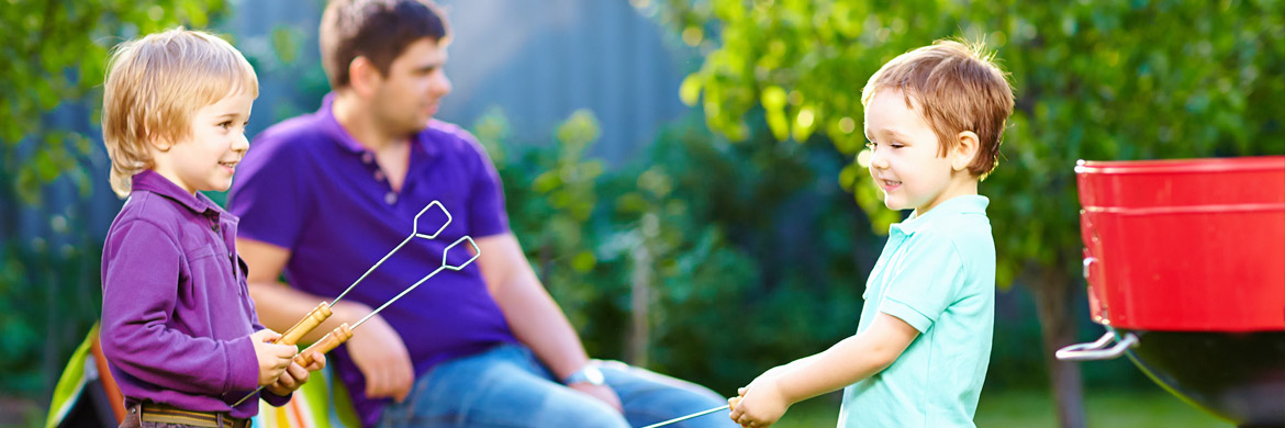 Homeowner relaxing on a porch overlooking a beautifully landscaped yard
