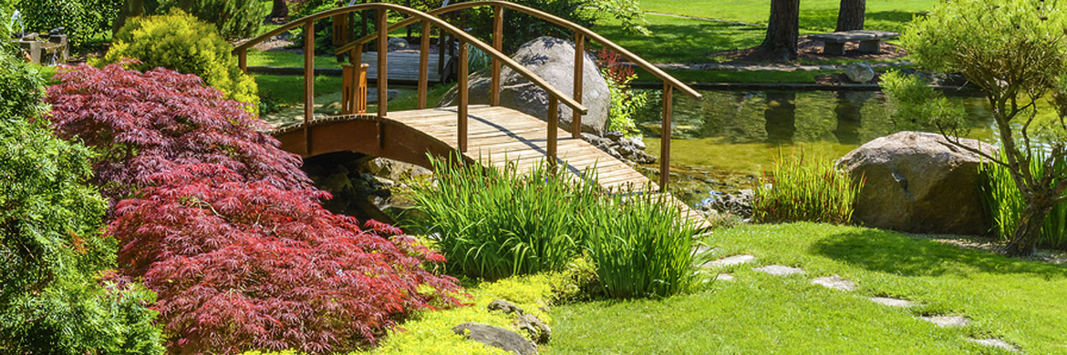 Natural stone accents integrated into a residential landscape design in Greater Binghamton NY